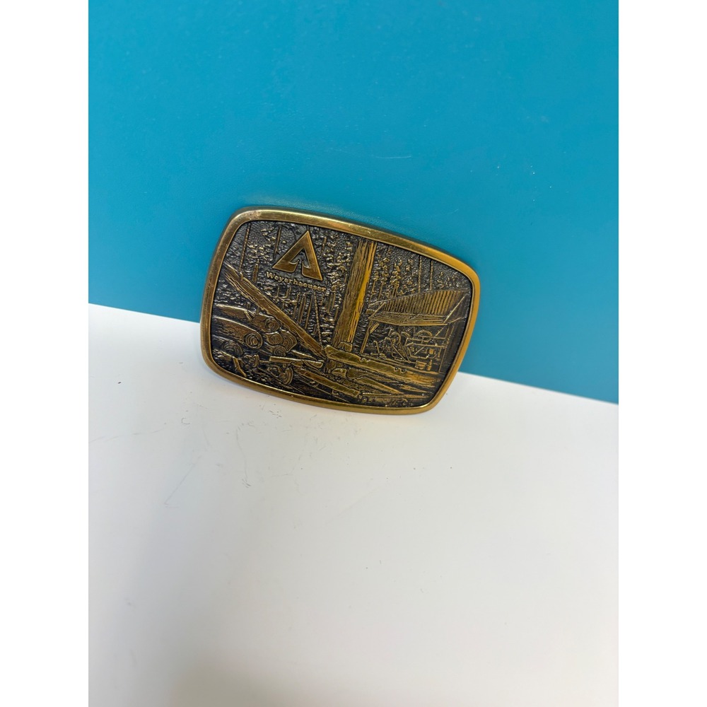 Vtg 1981 Weyerhaeuser Solid Brass Belt Buckle BTS Made in USA Logging Sawmill